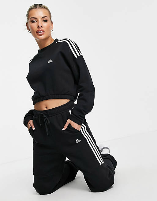 Women adidas Training oversized joggers with three stripes in black 