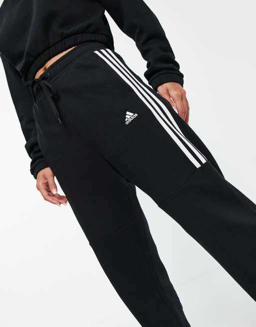 adidas Training oversized joggers with three stripes in black ASOS