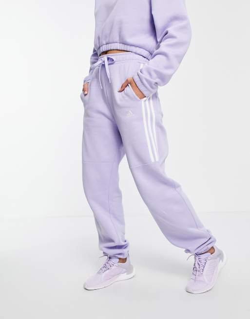 adidas Training oversized joggers with three stripes in lilac