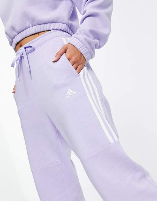 adidas Training oversized joggers with three stripes in lilac