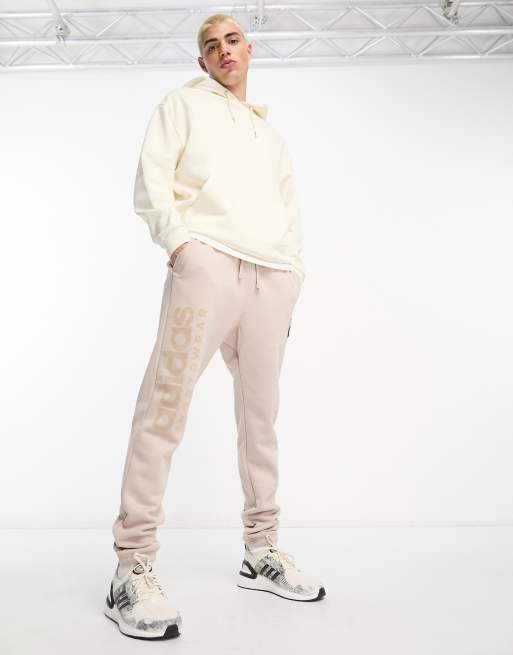 adidas Training - Pantalon de jogging confort en polaire - Marron