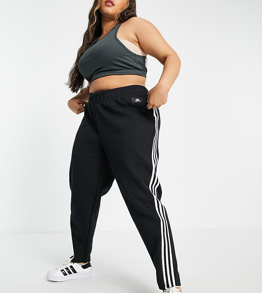 Adidas Training Plus trousers with three stripes in black