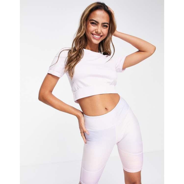 adidas Training seamless panelled short sleeve cropped top in light pink