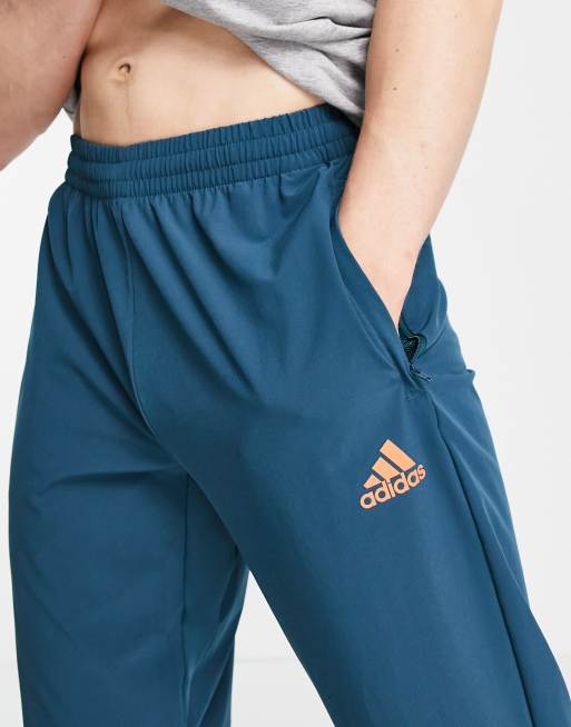 Teal adidas track pants sale