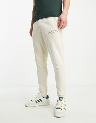 adidas Training Sports Club graphic trackies in white - ASOS Price Checker
