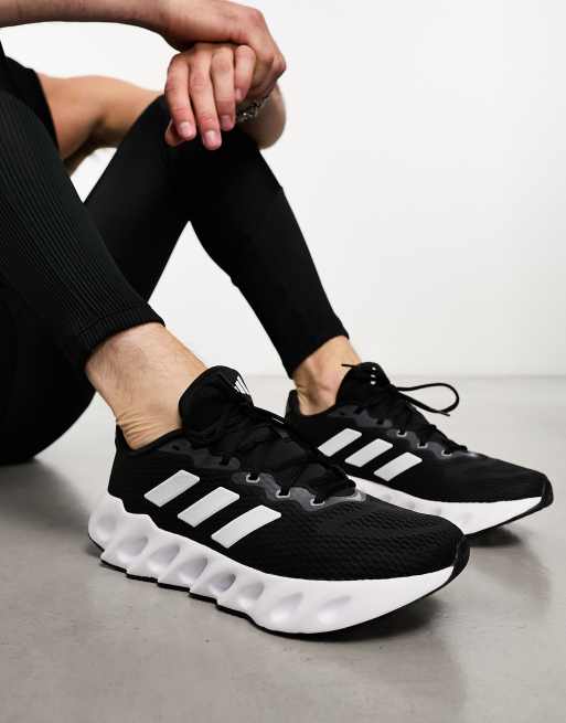 adidas Training Swift sneakers in black and white