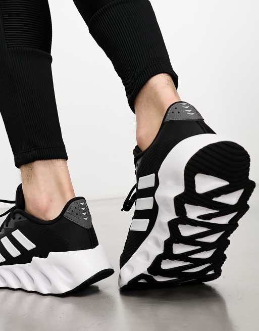 adidas Training Swift sneakers in black and white