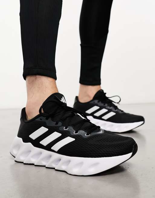 adidas Training Swift sneakers in black and white