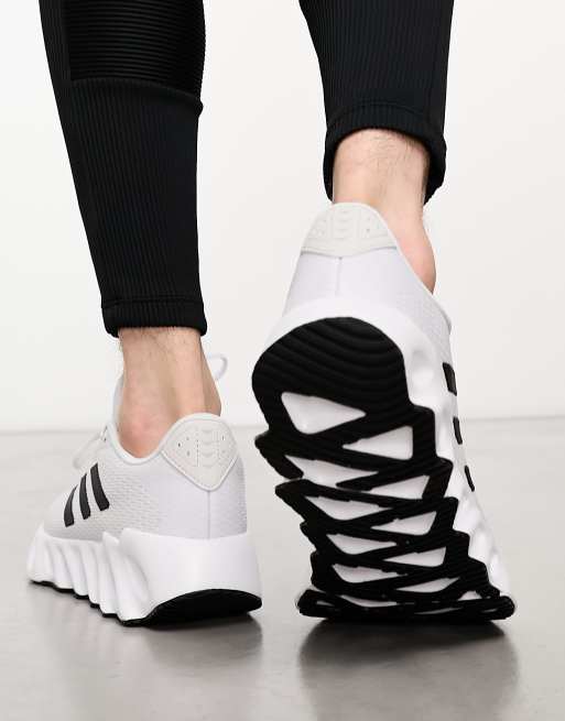 adidas Training Swift sneakers in white and black