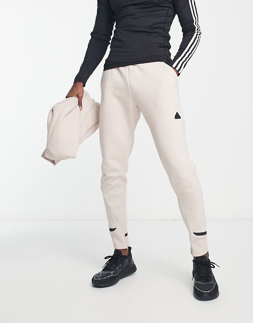 adidas Training tech fleece joggers in off white-Brown