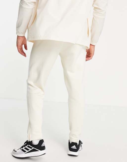 adidas Training trackies with white three stripes in cream, 3 of 4