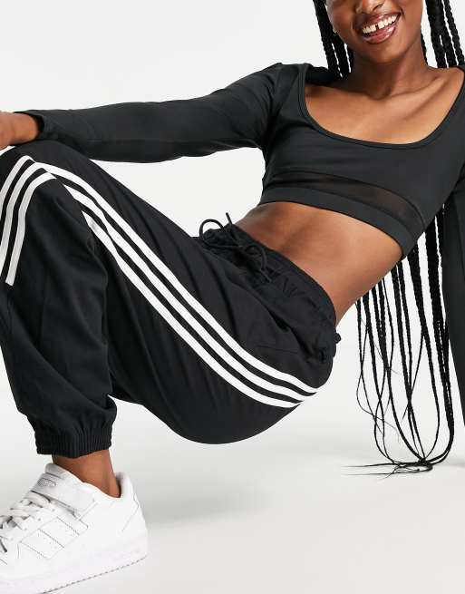 adidas woven track pants with 3 Stripes in black ASOS