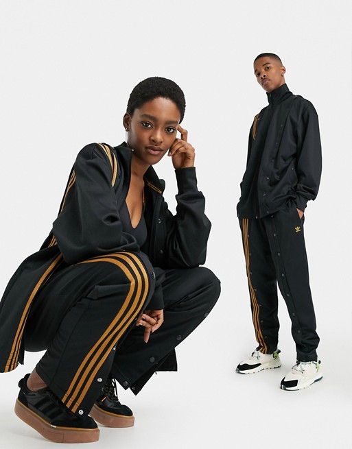 adidas x IVY PARK track pants in black with popper detail