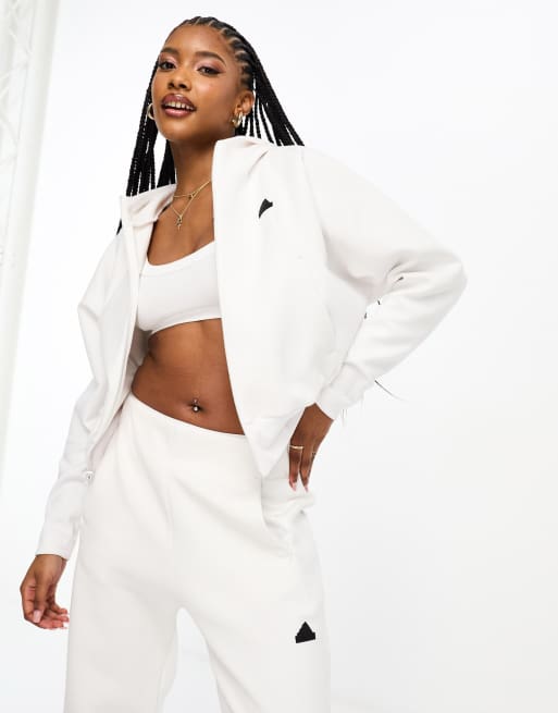 adidas X Jenna Ortega - Top della tuta bianco con logo, zip e maniche ad ali di pipistrello
