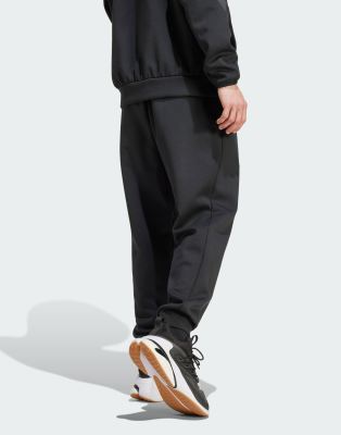 adidas - Z.N.E - Ensemble de surv??tement de qualit?� sup?�rieure - Noir | ASOS