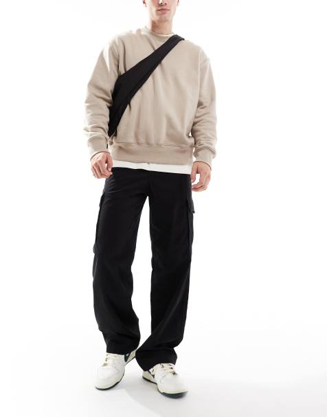 ADPT loose fit cargo trouser in black - view 1