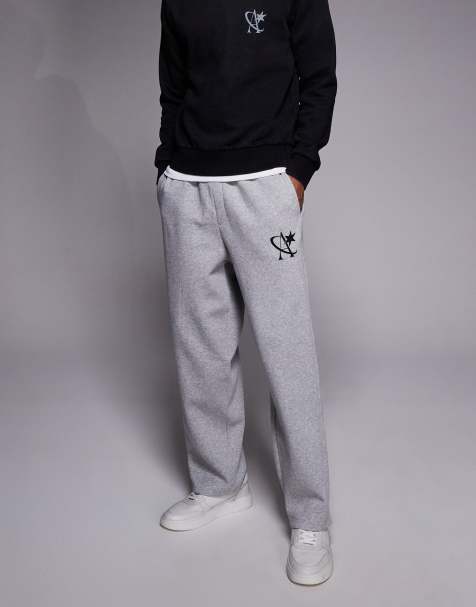 ADPT loose fit joggers with star logo in light grey