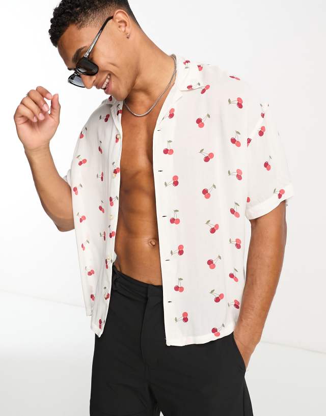 ADPT oversized revere collar short sleeve shirt in cherry print in white