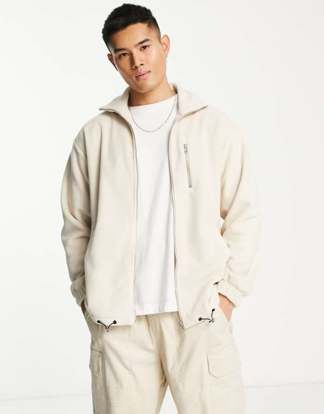 ADPT oversized zip through fleece with technical details in oatmeal