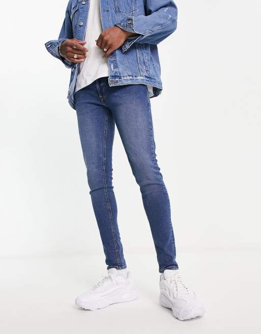 ASOS DESIGN super skinny jeans in mid wash blue with abrasions