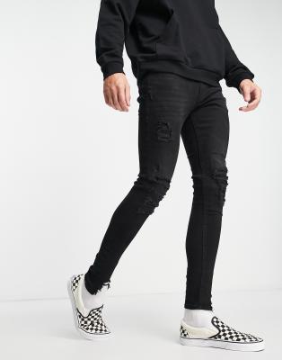 ADPT spray on skinny jean with heavy rips in washed black