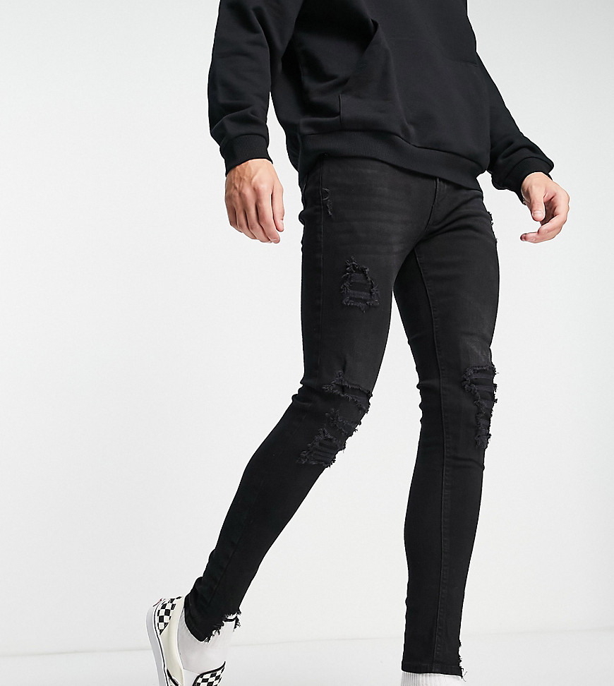 ADPT spray on skinny jean with heavy rips in washed black