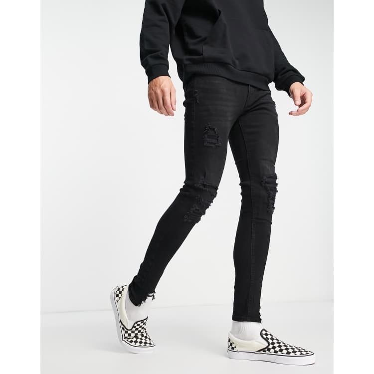 ASOS DESIGN super skinny jeans in washed black with paint splatter