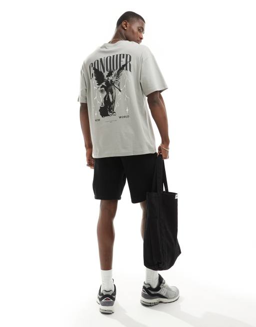 ADPT – Szary T-shirt oversize z nadrukiem anioła i napisem „Conquer” na plecach
