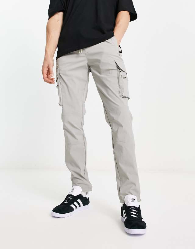 ADPT technical cargo pants in gray