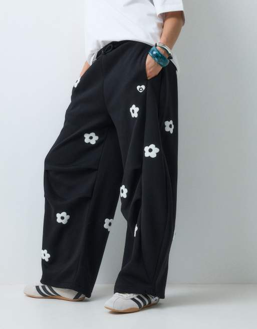 Aelfric Eden floral emboirdery barrel trackies in black, 2 of 5