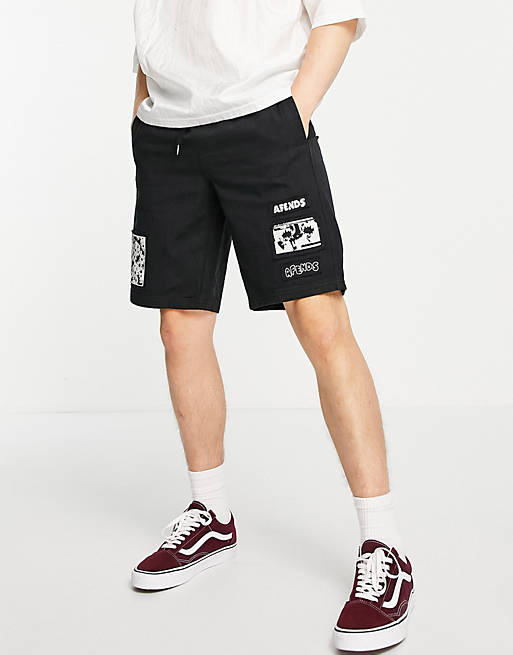 Afends Late Start jersey shorts in black with patch placement print