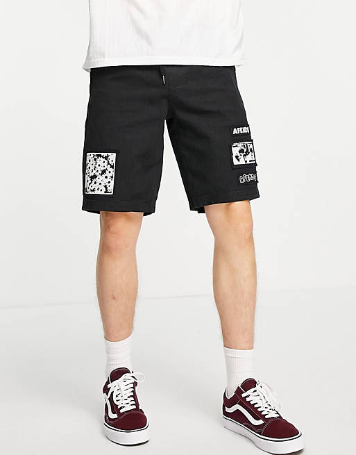  Afends Late Start jersey shorts in black with patch placement print 
