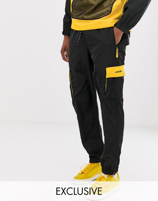 Agora tracksuit in black with utility pockets, 2 of 2