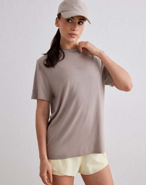 Aim'n - Camiseta color arcilla oscuro para correr sin costuras con estampado 