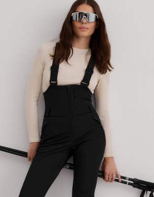 Aim'n - Elastische Thermo-Latzhose in Schwarz