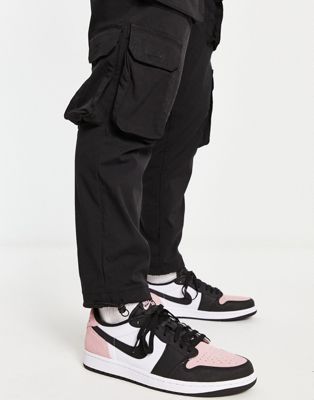 Air Jordan 1 Low OG trainers in black and bleached coral