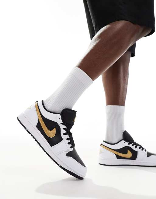 Air Jordan 1 low trainers in black white and gold