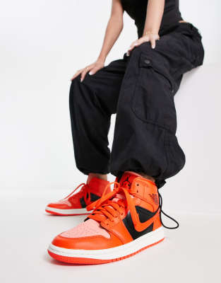 Jordan Air Jordan 1 Mid SE trainers in crimson and rush orange