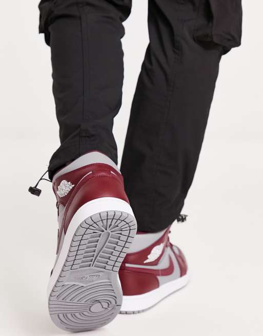 Air Jordan 1 Mid trainers in cherrywood red/cement grey | ASOS