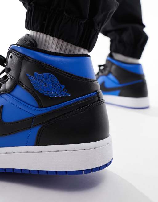 Royal blue shop and black sneakers