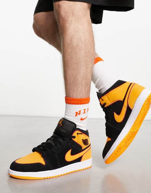 Jordan 1 mid store orange and black