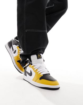 Air Jordan 1 Mid trainers in white and yellow