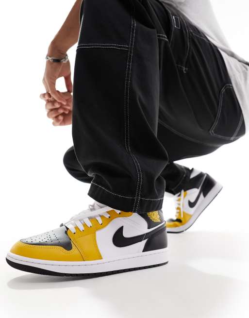 Yellow and black hot sale jordan 1 mid