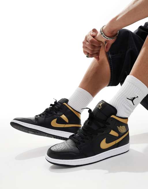 Air Jordan 1 Sneaker in Schwarz und Gold mit mittelhohem Schaft