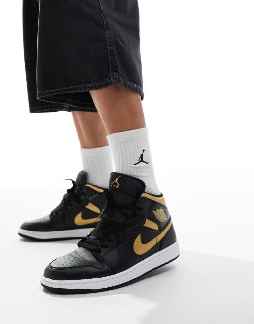 Air Jordan 1 Sneaker in Schwarz und Gold mit mittelhohem Schaft