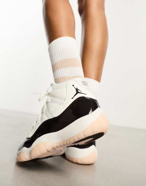 Air Jordan 11 Retro trainers in off white and velvet brown