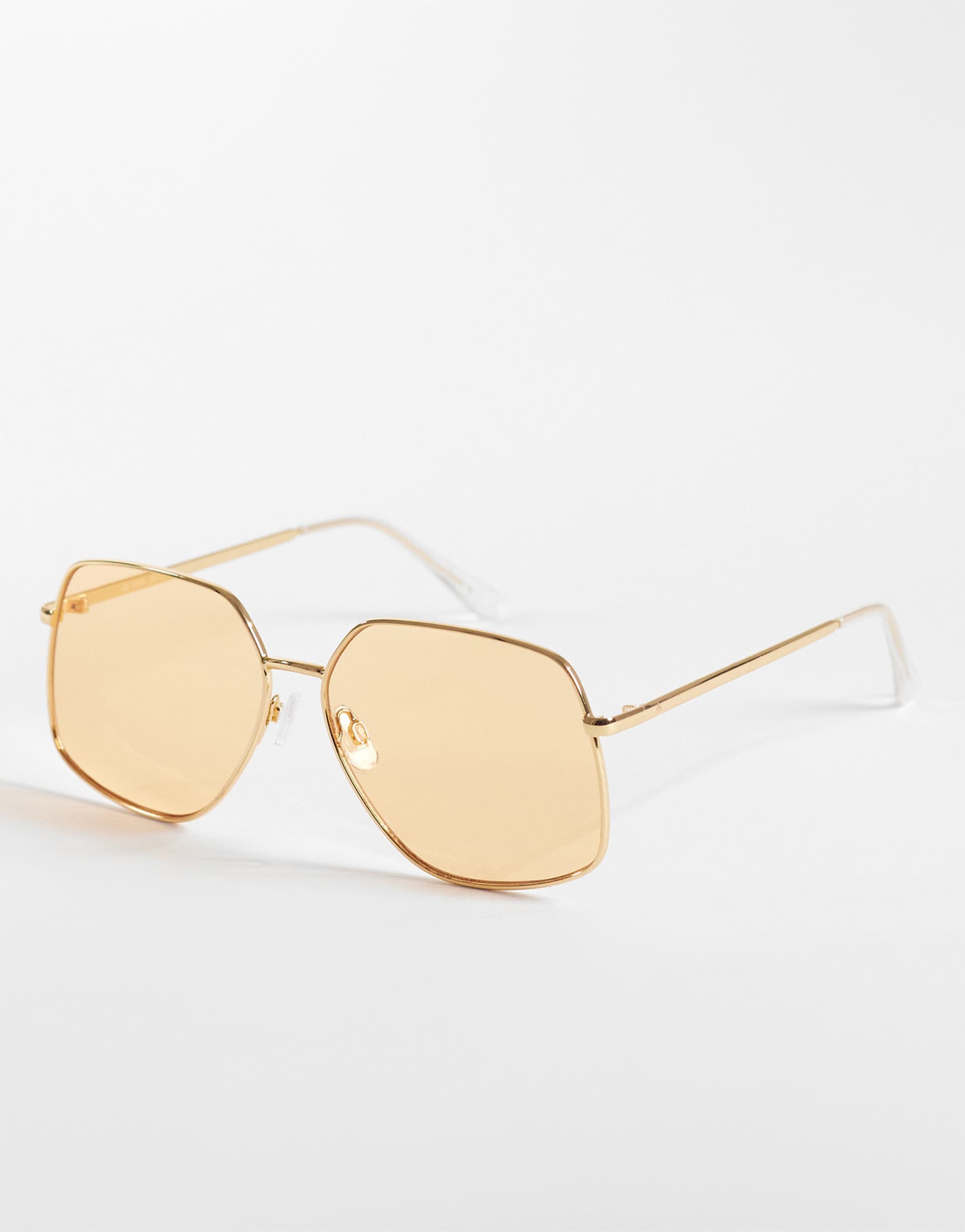 aire altair angular 70s aviator sunglasses in gold and amber tint