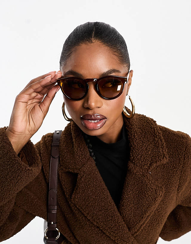 Aire - cursa round sunglasses in transparent brown
