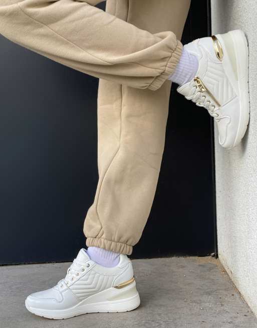 ALDO - Adwiwia - Sneakers met ritsdetail in wit/goud