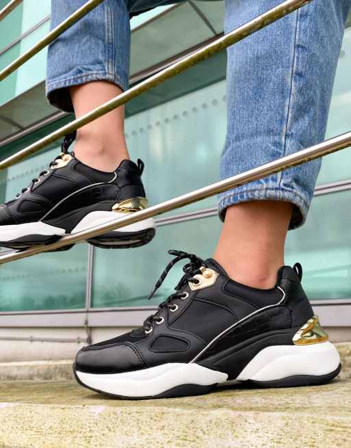 ALDO - Astiari - Sneakers met dikke zool in zwart/goud